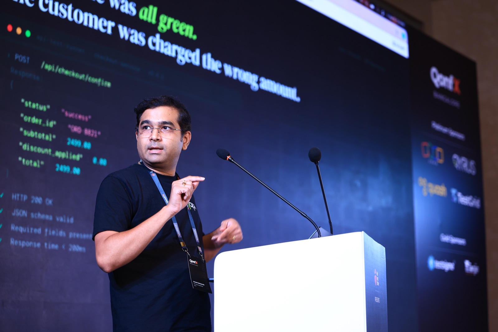 Ameet presenting an engineering demonstration on the QonfX stage